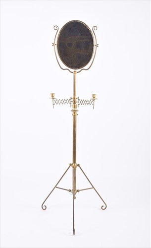 Lot 229 - A Victorian brass shaving mirror stand flanked...