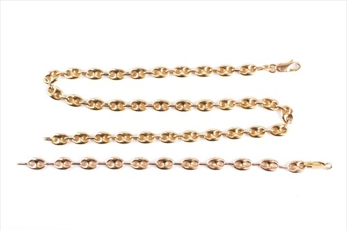 Lot 570 - A yellow metal anchor-link chain necklace in...