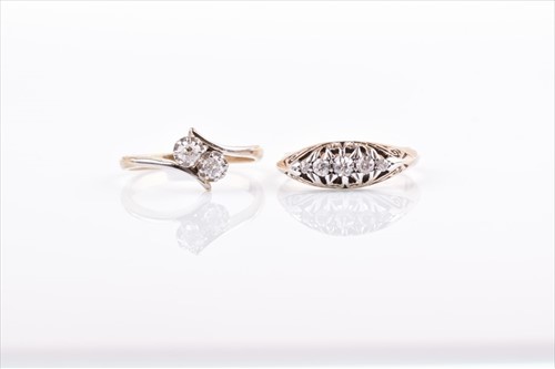 Lot 582 - A diamond crossover ring set with two old...