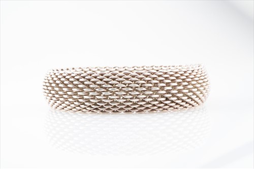 Lot 580 - Tiffany & Co. A silver mesh bracelet internal...