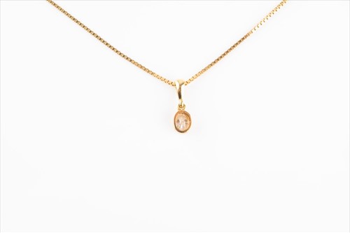 Lot 581 - A yellow gold and diamond pendant the mixed...