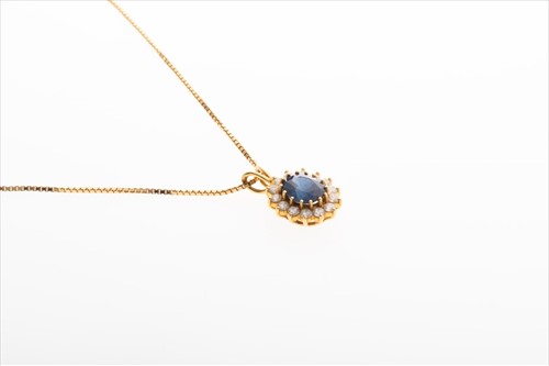 Lot 572 - An 18ct yellow gold, diamond, and sapphire...