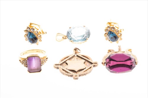 Lot 569 - An 18ct yellow gold and amethyst ring set with...