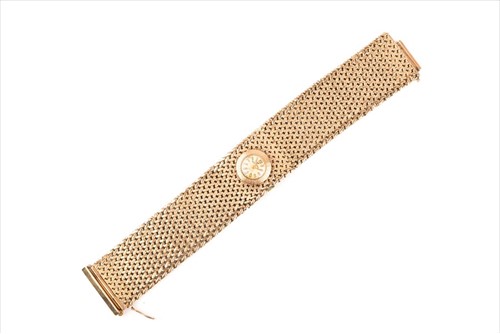 Lot 602 - A ladies yellow metal bracelet watch the wide...