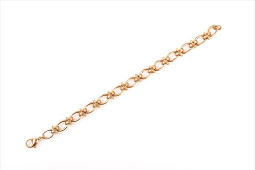 Lot 601 - A yellow gold fancy-link bracelet marked 375,...