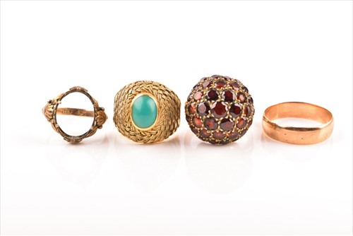 Lot 599 - A yellow metal and turquoise domed ring...