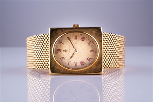 Lot 332 - A yellow metal gentleman's wristwatch by Corum...