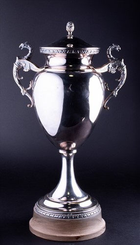 Lot 343 - A silver plated trophy cup the lid with acorn...