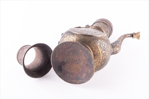 Lot 168 - A Middle Eastern damascene brass teapot...