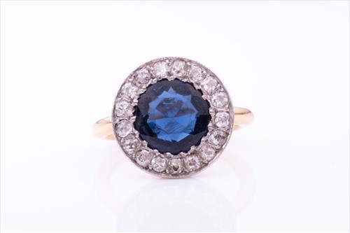 Lot 650 - A diamond and blue paste ring the circular...