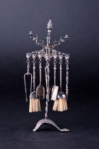 Lot 386 - A Continental white metal miniature candelabra...