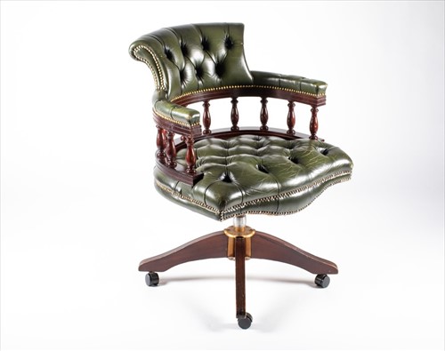 Lot 54 - A 20th century mahogany captain's chair with...