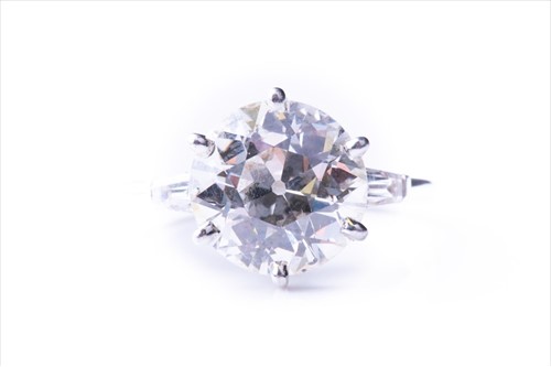 Lot 521 - An impressive round brilliant-cut solitaire...