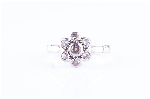 Lot 520 - An 18ct white gold and diamond daisy cluster...