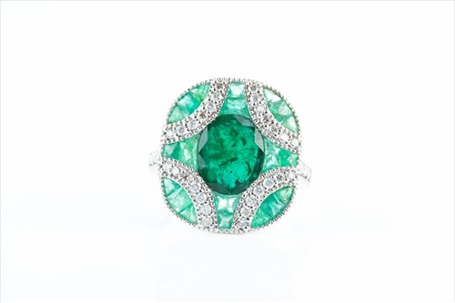 Lot 508 - A diamond and emerald cocktail ring in the Art...