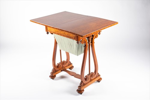 Lot 57 - An early 20th century sewing and games table...