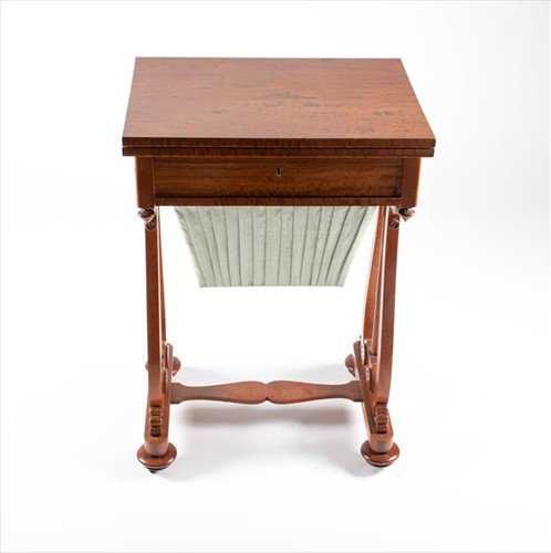 Lot 57 - An early 20th century sewing and games table...