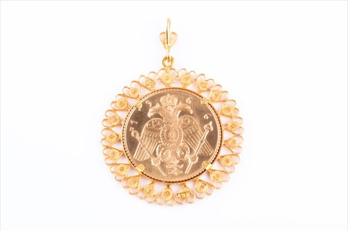 Lot 505 - A yellow metal coin pendant set with a Greek...