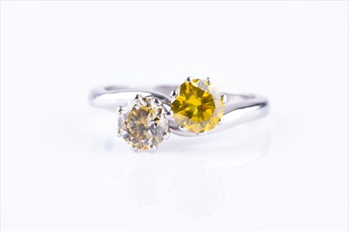 Lot 417 - A platinum and yellow diamond crossover ring...