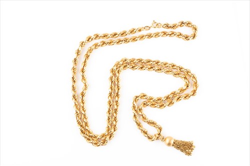 Lot 515 - A yellow metal rope twist necklace with tassle...