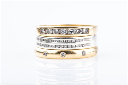 Lot 413 - An 18ct yellow gold and diamond eternity ring...