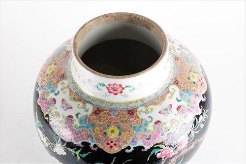 Lot 146 - A Qing dynasty famille noire porcelain vase...