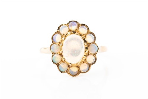 Lot 381 - A 9ct yellow gold and opal cluster ring of...