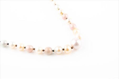 Lot 433 - An opera length natural pearl necklace...