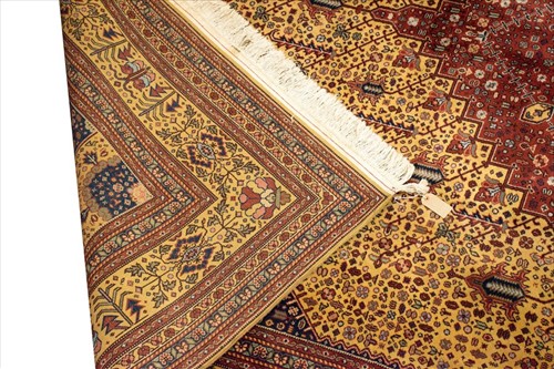Lot 125 - A large modern Persian Tabriz style carpet...