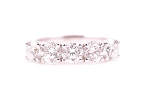 Lot 731 - An 18ct white gold and diamond ring set with...