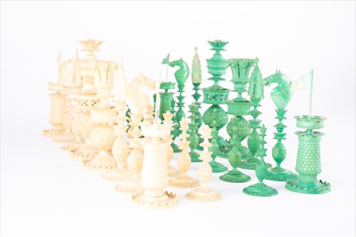 Lot 150 - A 19th century Indian carved ivory chess set...