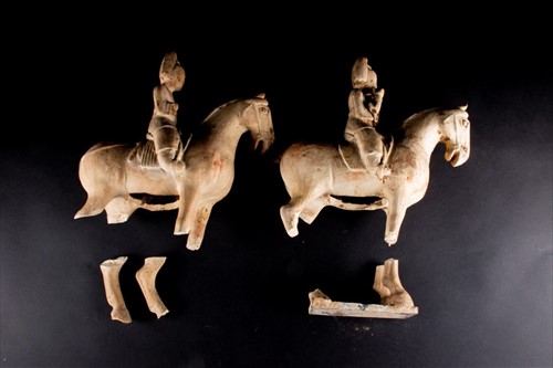 Lot 151 - A pair of painted pottery figure of a horse...