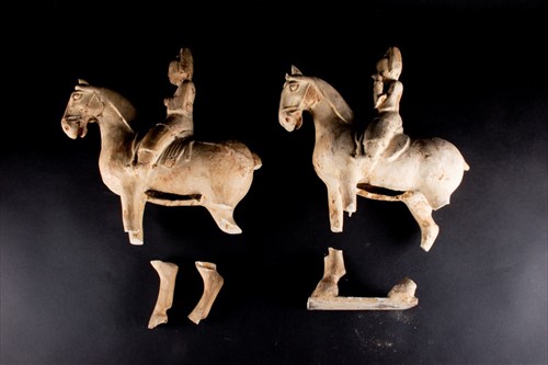 Lot 151 - A pair of painted pottery figure of a horse...