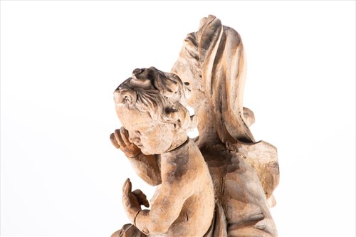 Lot 212 - A 19th century limewood carved figure of the...