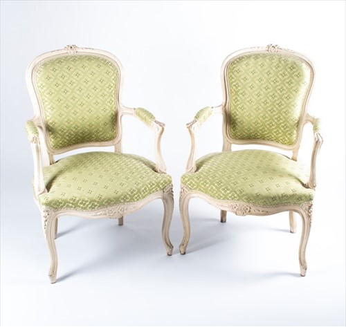 Lot 101 - A pair of Louis XV style bergere armchairs...