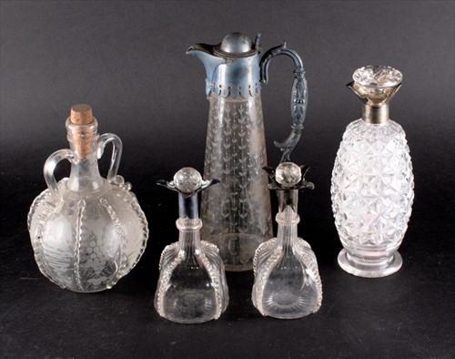 Lot 343 - An Edwardian silver-collared decanter of tall...