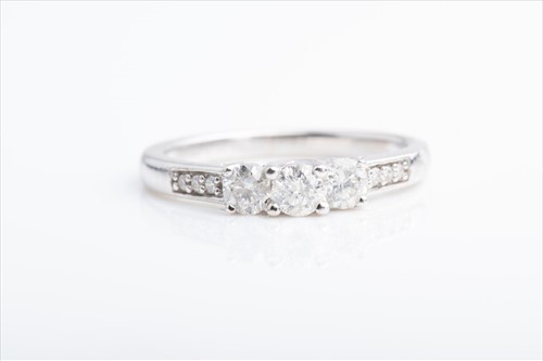 Lot 433 - An 18ct white gold and diamond ring set with...