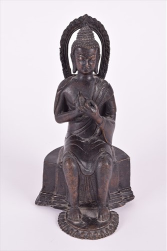 Lot 254 - A early Tibetan bronze of buddha possibly from...