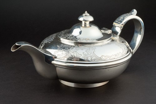 Lot 350 - A Victorian silver teapot in fitted box London...