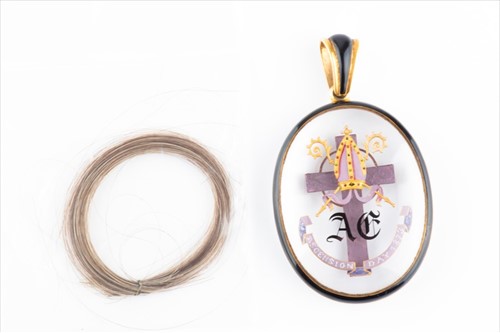 Lot 455 - An unusual glass and enamel mourning pendant...