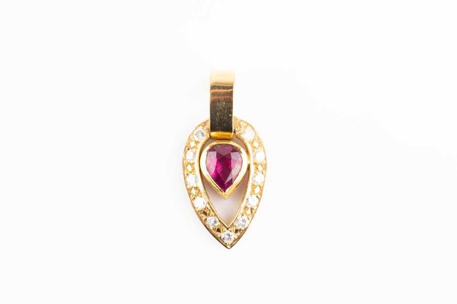 Lot 355 - A diamond and ruby pendant centred with a...