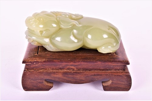 Lot 88 - A 19th century jade figure of a fo dog the...
