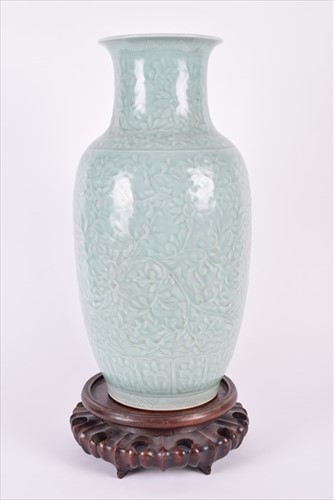 Lot 196 - A 19th century Chinese celadon vase on lotus...