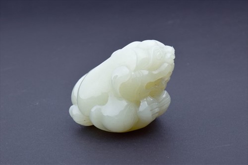 Lot 133 - A 19th century mutton jade figure of a...