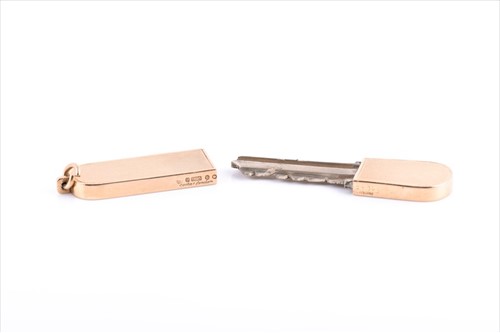 Lot 524 - A 9 carat gold key holder and cover by Cartier...