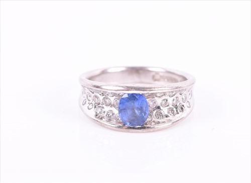 Lot 718 - An 18ct white gold, diamond, and tanzanite...