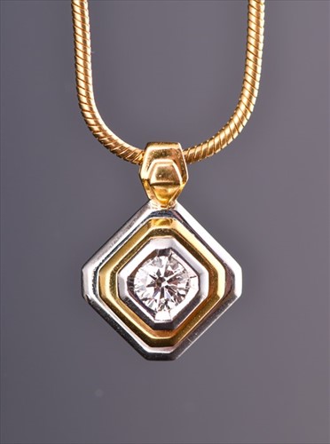 Lot 703 - An 18ct yellow and white gold and diamond...