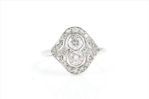 Lot 601 - An 18ct white gold and diamond ring in the Art...
