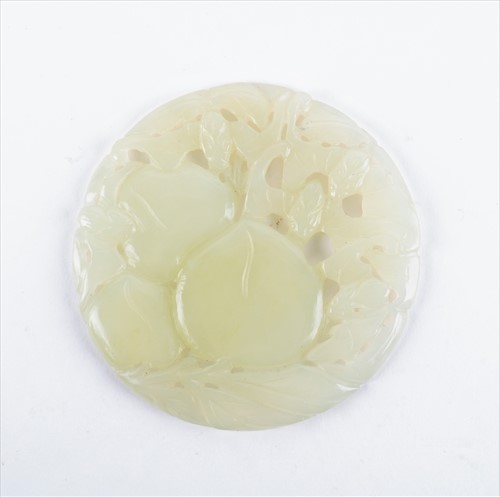 Lot 174 - A Chinese jade pendant of circular form with...