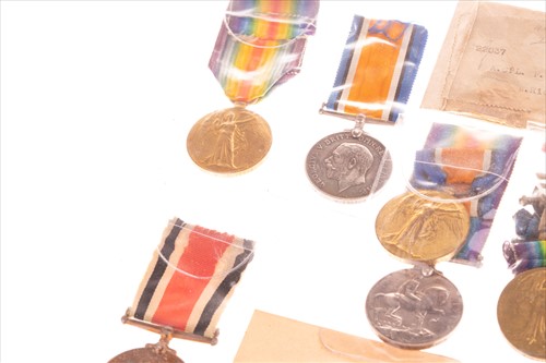 Lot 251 - A collection of six WWI medal groups largely...